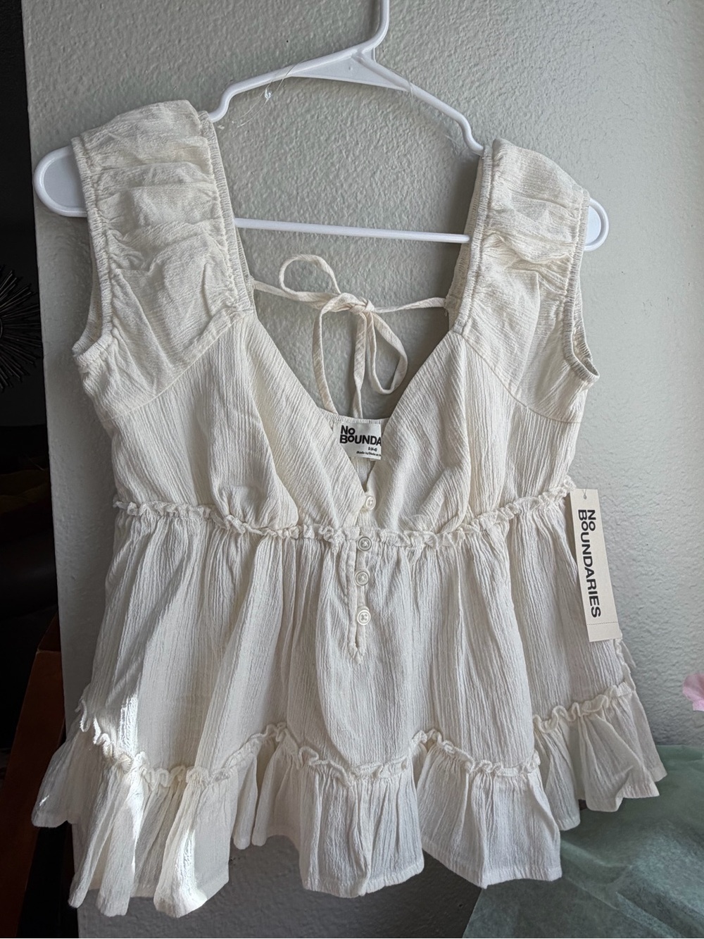 No Boundaries Ivory Ruffle Peplum Tank